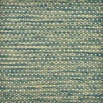 Detail of a handowven rug with a textural strié pattern in shades of green