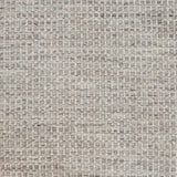 Textured handwoven carpet in light grey.