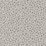 Detail of fabric in a painterly animal print in white and gray on a light gray field.