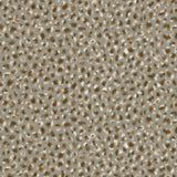 Detail of wallpaper in a painterly animal print in white and brown on a gray field.