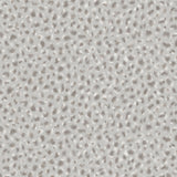 Detail of wallpaper in a painterly animal print in white and gray on a light gray field.