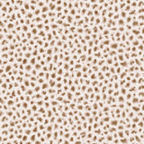 Detail of wallpaper in a painterly animal print in cream and brown on a white field.