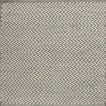 Textured rug with a herringbone pattern in white and grey