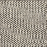 Textured rug with a herringbone pattern in white and charcoal grey