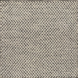 Textured rug with a herringbone pattern in white and charcoal grey