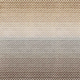 Broadloom carpet in a herringbone pattern in a subtle ombré color from warm brown to tan.
