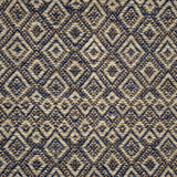 Handwoven rug detail in a diamond design in blue, cream and yellow
