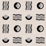 Graphic geometric pattern of circles, and stripes in black and grey on a cream field.