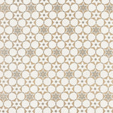 Fabric in a geometric star print in shades of brown and tan on a white field.