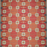 Decorative rug with geometric pattern on a red background