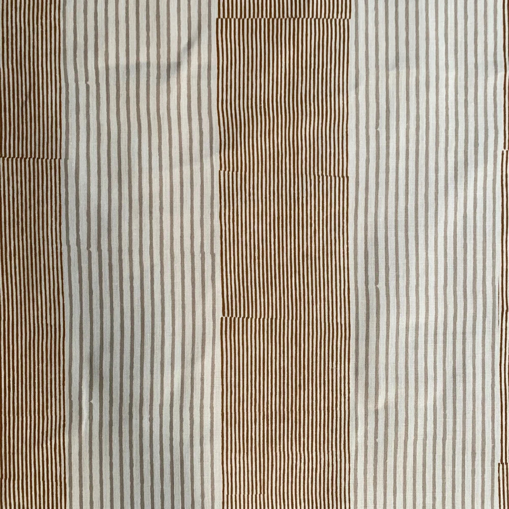 Close-up of fabric with brown and beige striped pattern