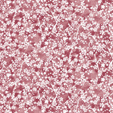 Painterly branch print in white on a berry red watercolor field.