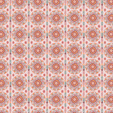 Full repeat image of a hand-drawn Suzani motif in shades of pink, orange and slate blue on a pale pink ground.