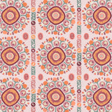 Detail of a hand-drawn Suzani motif in shades of pink, orange and slate blue on a pale pink ground.
