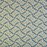 Detail of fabric in painterly diamond print in blue and green on a white field.