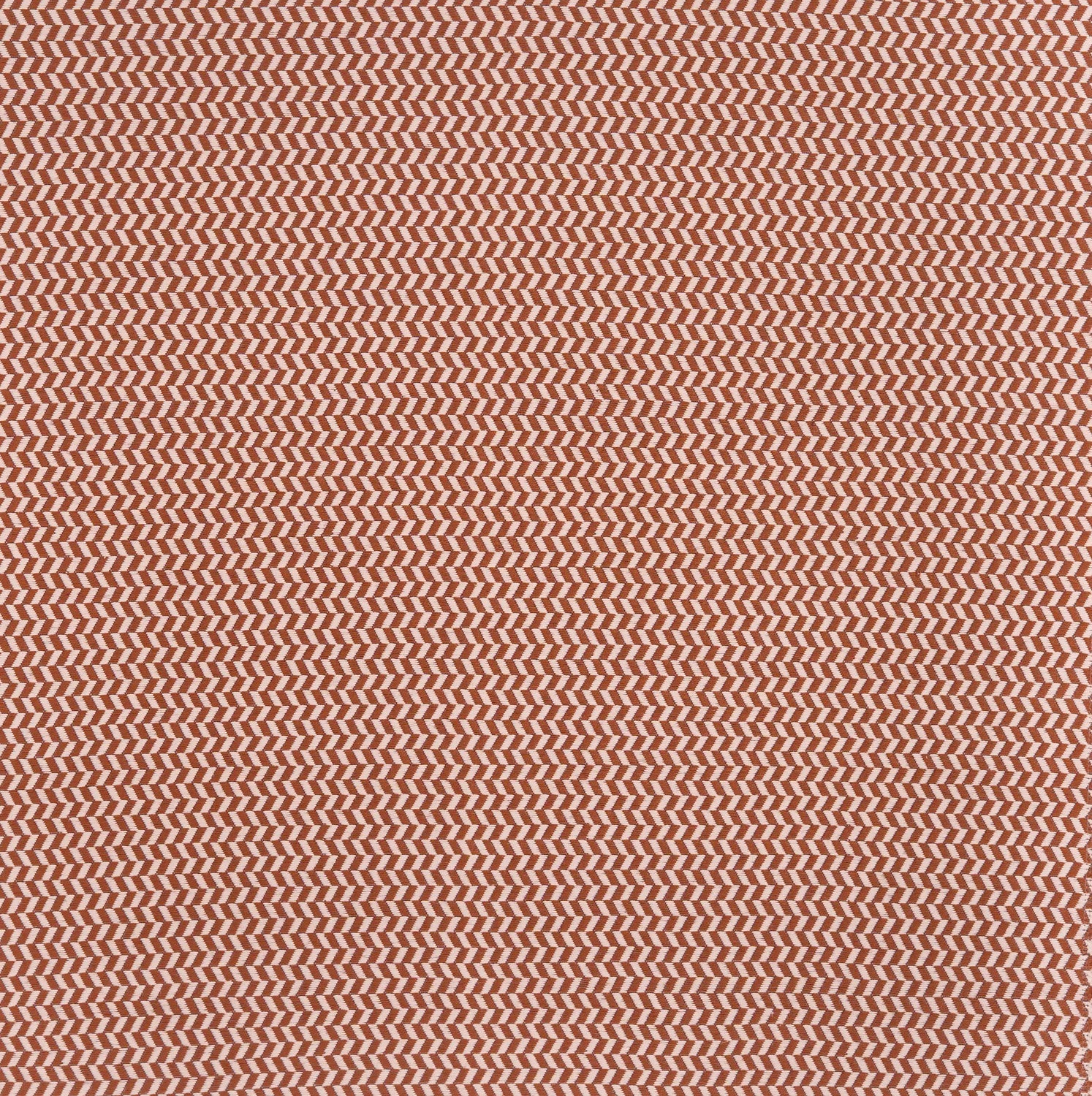 Herringbone woven fabric in rust red.
