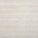 Broadloom carpet in a wide stripe pattern in tonal white. 