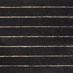Broadloom carpet in a wide stripe pattern in dark grey and cream.