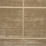 Textural performance broadloom carpet in grid design in tan.