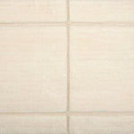 Textural performance broadloom carpet in grid design in cream