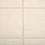 Textural performance broadloom carpet in grid design in cream