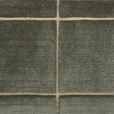 Textural performance broadloom carpet in grid design in dark green.
