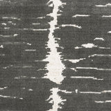 Broadloom carpet in a dimensional abstract painterly pattern in grey on a cream field.