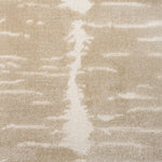 Broadloom carpet in a dimensional abstract painterly pattern in warm beige on a cream field.