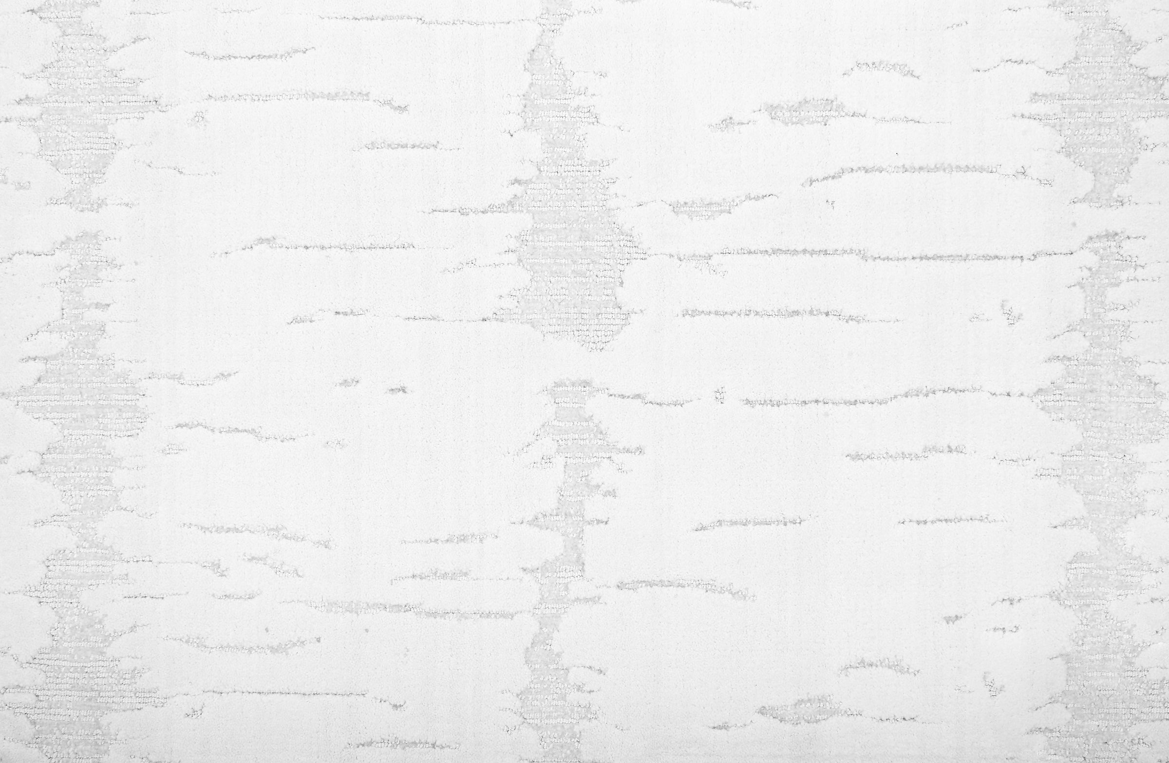Broadloom carpet in a dimensional abstract painterly pattern in bright white on a pale grey field.