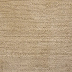 Broadloom carpet swatch in a solid pattern in a tan design