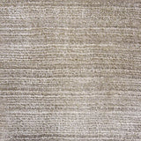 Broadloom carpet swatch in a solid pattern in a light tan design