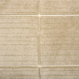 Textural performance broadloom carpet in grid design in tan.