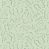 Detail of wallpaper in a painterly botanical print in green and white on a light green field.