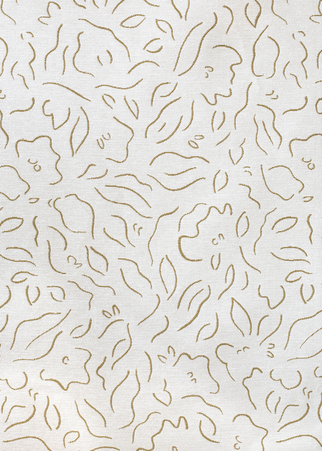 Detail of fabric in a minimalist floral print in brown on a cream field.