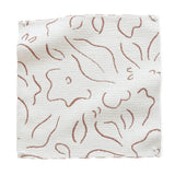 Fabric swatch with brown floral pattern on white background