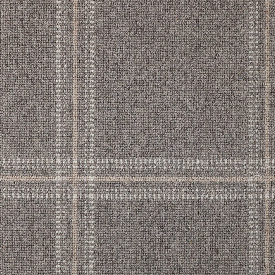 Broadloom carpet with window pane check in white and beige on dark grey.