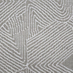 Broadloom carpet sample in a geometric linear pattern in cream on a taupe field. 