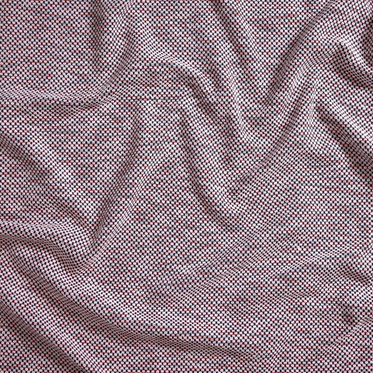 Close up of gently draped woven Indoor-Outdoor fabric with basketweave texture in white and navy blue.