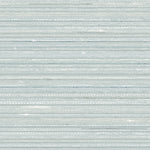 Detail of fabric in a textural striped pattern in shades of aqua blue.