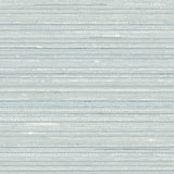 Detail of fabric in a textural striped pattern in shades of aqua blue.