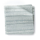 Stacked swatches of fabric in a textural striped pattern in shades of aqua blue.