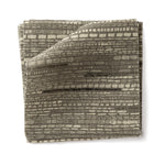 Stacks of fabric swatches textural striped pattern in shades of muted olive green on a white background.