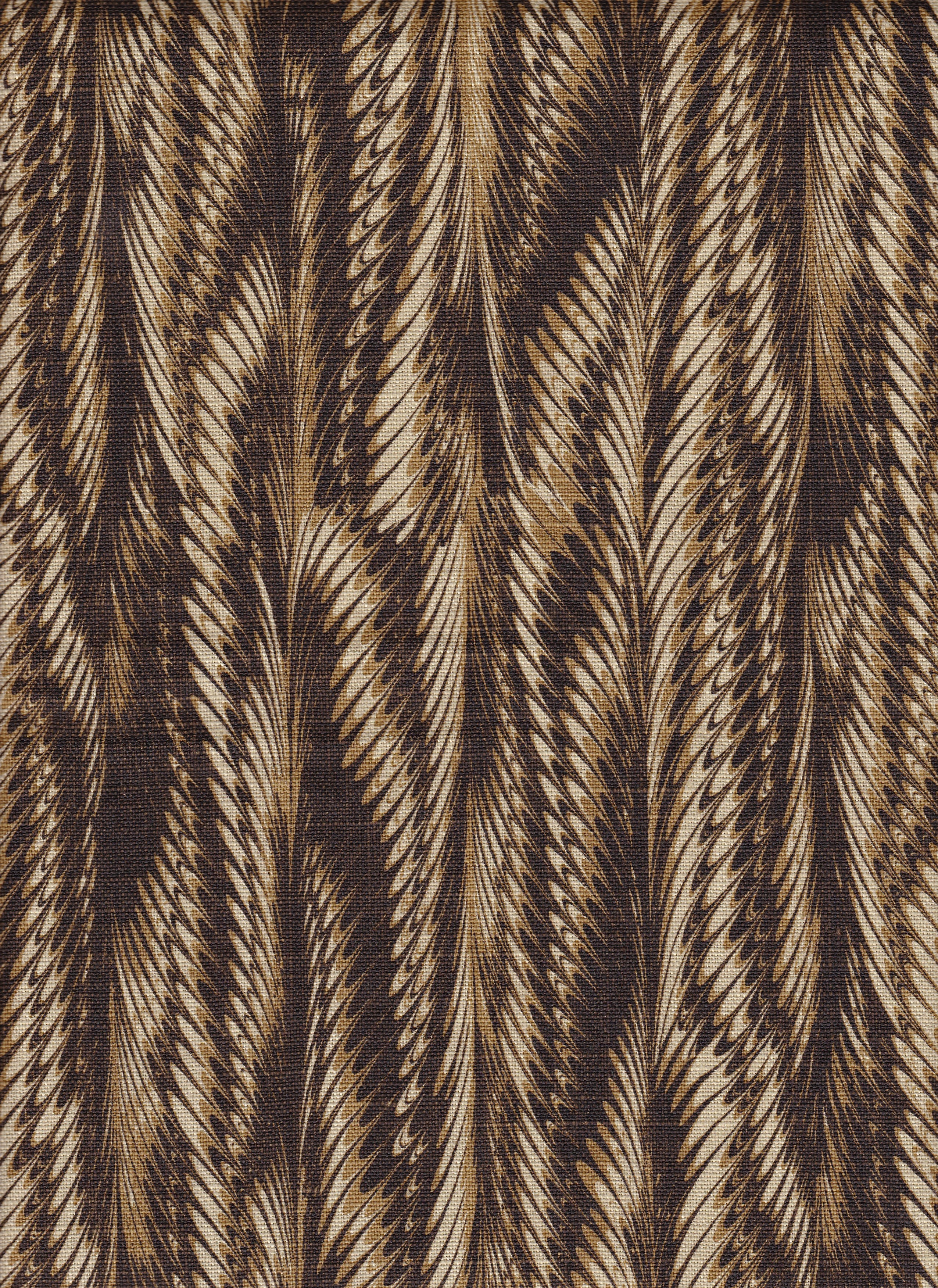 Detail of fabric in a marbled paint print in shades of brown and tan.