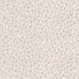 Detail of wallpaper in a painterly animal print in shades of beige, grey and cream. 