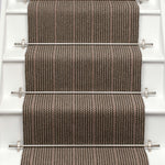 Striped flatweave runner in brown and red on white staircase