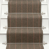 Striped flatweave runner in grey and red on white staircase