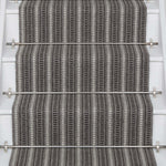 Striped flatweave runner in grey and black on white staircase