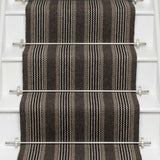 Striped flatweave runner in dark grey and black on white staircase