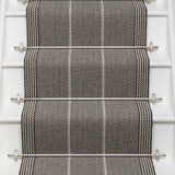 Striped flatweave runner in grey and black on white staircase