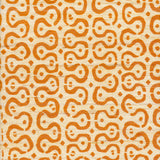 Detail of fabric in a curvilinear stripe pattern in orange on a cream field.